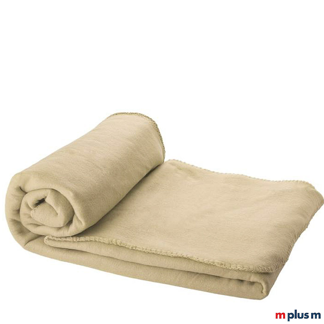 Die beige 'Huggy' Decke besteht aus weichem und bequemem Polarfleece. Ab einer Menge von 50 Stück können Sie die Decke bedrucken lassen
